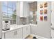 Kitchen coffee bar with white cabinets and quartz countertop at 7946 Tybee Ct, University Park, FL 34201