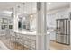 Stylish kitchen with white cabinetry, quartz countertops, and an island with seating at 7946 Tybee Ct, University Park, FL 34201