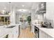 Bright kitchen with white cabinets, stainless steel appliances, and a breakfast nook at 7946 Tybee Ct, University Park, FL 34201