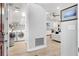 Convenient laundry room with washer, dryer, and storage shelves at 7946 Tybee Ct, University Park, FL 34201