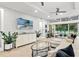 Spacious living room with comfy seating, large TV, and access to a patio at 7946 Tybee Ct, University Park, FL 34201