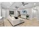 Living area with light beige sofa and a large TV at 7946 Tybee Ct, University Park, FL 34201