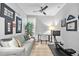 Functional home office with a comfortable couch and rowing machine at 7946 Tybee Ct, University Park, FL 34201