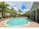 Resort-style pool with ample lounge chairs and surrounding patio at 7946 Tybee Ct, University Park, FL 34201