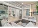Open sunroom showcasing views of the living room and backyard at 7946 Tybee Ct, University Park, FL 34201