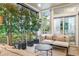 Bright sunroom features comfortable seating and ample natural light at 7946 Tybee Ct, University Park, FL 34201