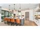 Modern kitchen with stainless steel appliances and a large island at 8144 Moonbeam Ave, Sarasota, FL 34241
