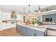 Open concept kitchen with a large island and stainless steel appliances at 8144 Moonbeam Ave, Sarasota, FL 34241