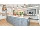 Open concept kitchen with a large island and stainless steel appliances at 8144 Moonbeam Ave, Sarasota, FL 34241