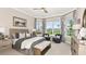 Spacious main bedroom with large windows and sitting area at 8144 Moonbeam Ave, Sarasota, FL 34241