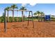 playground with swings and play structure at 8144 Moonbeam Ave, Sarasota, FL 34241