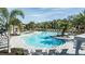 Freeform community pool with ample lounge chairs at 8144 Moonbeam Ave, Sarasota, FL 34241