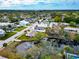 Aerial view of a house and neighborhood, showcasing waterfront property and lush landscaping at 905 69Th Nw St, Bradenton, FL 34209