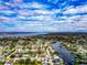 Aerial view showcasing a single Gathering home and surrounding neighborhood, near the water at 905 69Th Nw St, Bradenton, FL 34209