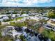 Aerial view of a house and neighborhood, showcasing waterfront property and lush landscaping at 905 69Th Nw St, Bradenton, FL 34209