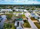 Aerial view of a house and neighborhood, showcasing waterfront property and lush landscaping at 905 69Th Nw St, Bradenton, FL 34209