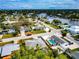 Aerial view of a house and neighborhood, showcasing waterfront property and lush landscaping at 905 69Th Nw St, Bradenton, FL 34209