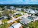 Aerial view of a house and neighborhood, showcasing waterfront property and lush landscaping at 905 69Th Nw St, Bradenton, FL 34209