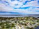 Aerial view showcasing a single Gathering home and surrounding neighborhood, near the water at 905 69Th Nw St, Bradenton, FL 34209