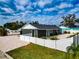 White vinyl fence surrounds the backyard of the home at 905 69Th Nw St, Bradenton, FL 34209