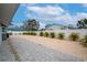 Landscaped backyard with paver patio and tropical plants at 905 69Th Nw St, Bradenton, FL 34209