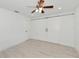 Bright bedroom with white barn doors and wood floors at 905 69Th Nw St, Bradenton, FL 34209