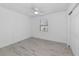 Simple bedroom with ceiling fan, window, and hardwood floors at 905 69Th Nw St, Bradenton, FL 34209