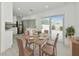 Dining area with wooden table and chairs, adjacent to kitchen at 905 69Th Nw St, Bradenton, FL 34209