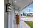 Side view of the house, showcasing the modern light fixture at 905 69Th Nw St, Bradenton, FL 34209