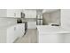 Modern white kitchen with stainless steel appliances at 905 69Th Nw St, Bradenton, FL 34209