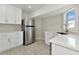 White cabinets, stainless steel appliances, and quartz countertops at 905 69Th Nw St, Bradenton, FL 34209