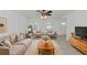 Living room with beige sofa, armchairs, and a wood coffee table at 905 69Th Nw St, Bradenton, FL 34209