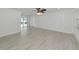 Spacious living area with wood-look floors and sliding glass doors at 905 69Th Nw St, Bradenton, FL 34209