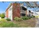 Brick building exterior with screened balcony and landscaping at 9100 Dr Martin Luther King Jr N St # 1302, St Petersburg, FL 33702
