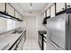 Galley kitchen with stainless steel appliances at 9100 Dr Martin Luther King Jr N St # 1302, St Petersburg, FL 33702