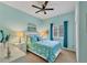 Bright bedroom with a queen-size bed and calming decor at 9414 Forest Hills Cir, Sarasota, FL 34238