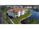 Aerial view of condo building near a lake at 1000 San Lino Cir # 1032, Venice, FL 34292