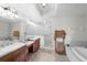 Double vanity bathroom with soaking tub and walk-in shower at 1000 San Lino Cir # 1032, Venice, FL 34292