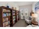 Well-lit community library with bookshelves and comfy chairs at 1000 San Lino Cir # 1032, Venice, FL 34292