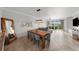 Bright dining room with a farmhouse table and seating for six at 1000 San Lino Cir # 1032, Venice, FL 34292