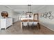 Spacious dining room with a large wooden table and wall decor at 1000 San Lino Cir # 1032, Venice, FL 34292