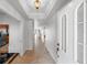 Interior hallway with tile flooring and access to other rooms at 1000 San Lino Cir # 1032, Venice, FL 34292
