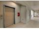 Condo hallway with elevator and fire alarm at 1000 San Lino Cir # 1032, Venice, FL 34292