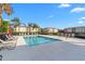 Inviting community pool with surrounding lounge chairs at 1000 San Lino Cir # 1032, Venice, FL 34292