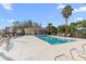 Community pool and adjacent lounge area with cabana at 1000 San Lino Cir # 1032, Venice, FL 34292