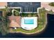 Community pool with lounge chairs and adjacent building at 1000 San Lino Cir # 1032, Venice, FL 34292
