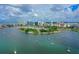 Stunning aerial view showcasing the city skyline with the marina, docked boats and gorgeous waterfront property at 101 S Gulfstream Ave # 16J, Sarasota, FL 34236