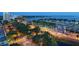 An aerial view of the condominium with a marina and city lights at night at 101 S Gulfstream Ave # 16J, Sarasota, FL 34236