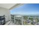 Balcony view with glass railings overlooking a cityscape and marina, highlighting the coastal lifestyle at 101 S Gulfstream Ave # 16J, Sarasota, FL 34236