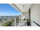 Balcony featuring comfortable seating and stunning views of the marina, cityscape, and open waters at 101 S Gulfstream Ave # 16J, Sarasota, FL 34236